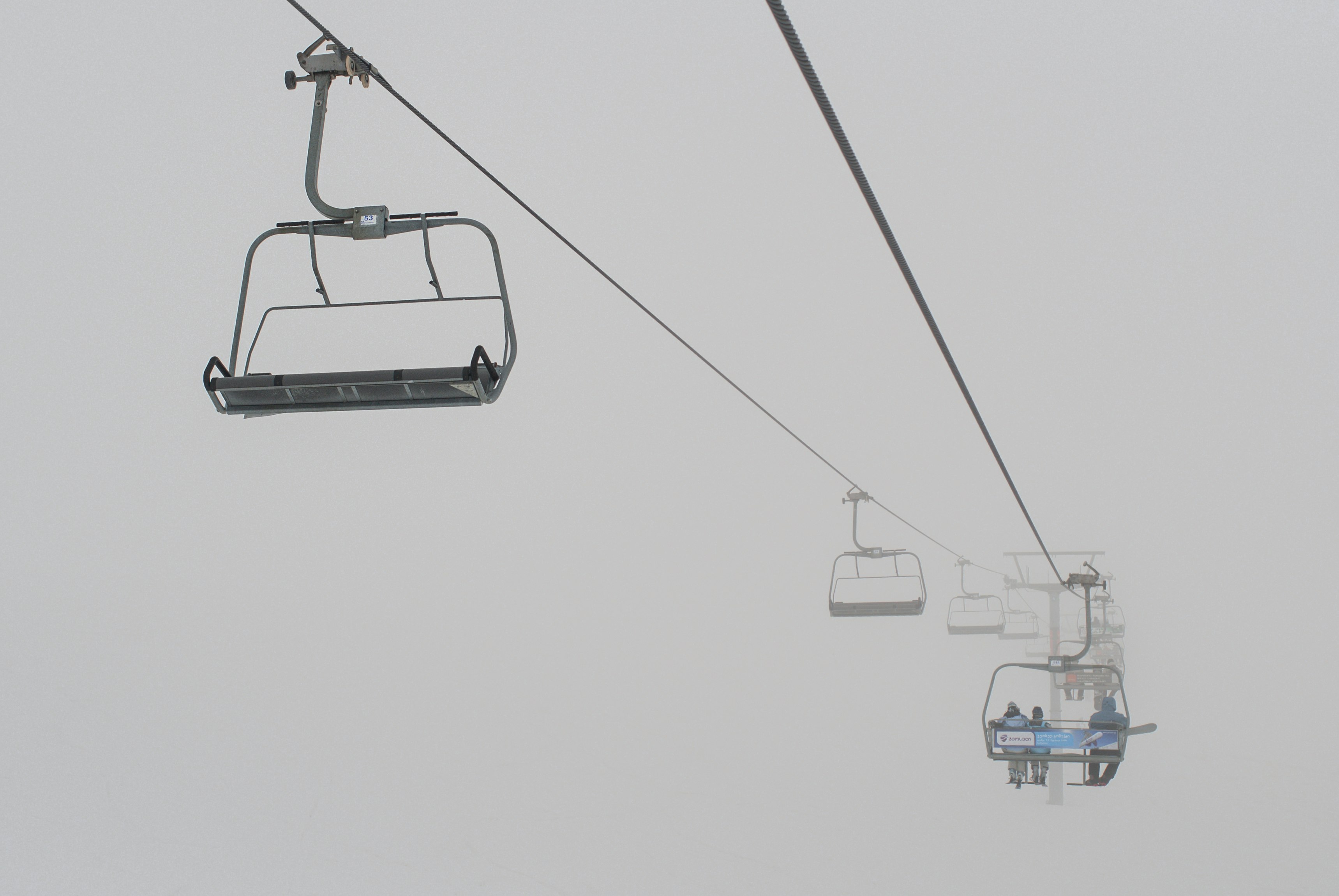 white and blue cable cars